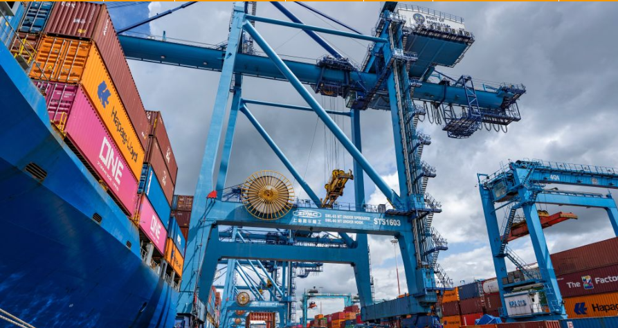 A crane hoists containers at the Port of Mombasa in Mombasa