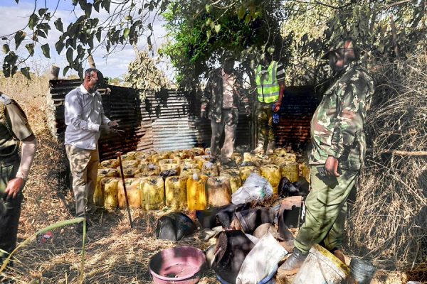 Police officers destroy illicit brew recovered during a multi-agency operation targeting illegal brewing dens in Marsabit County on Wednesday, September 23, 2026. PHOTO/@NPSOfficial_KE