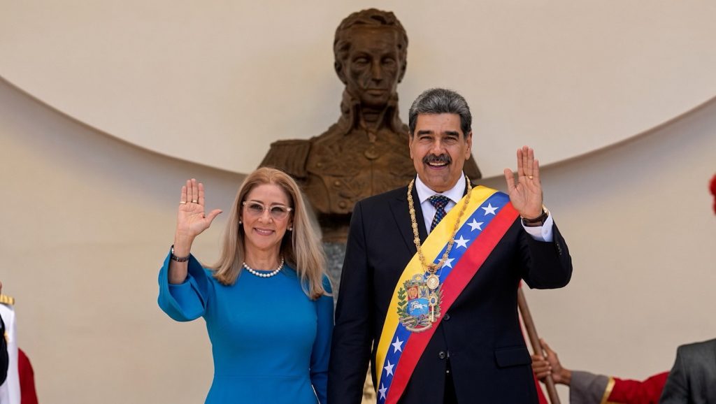 Venezuelan then-president Nicolas Maduro and his wife Cilia Flores wave after his swearing-in ceremony for a third term at the National Assembly in Caracas, Venezuela, on Jan. 10, 2025